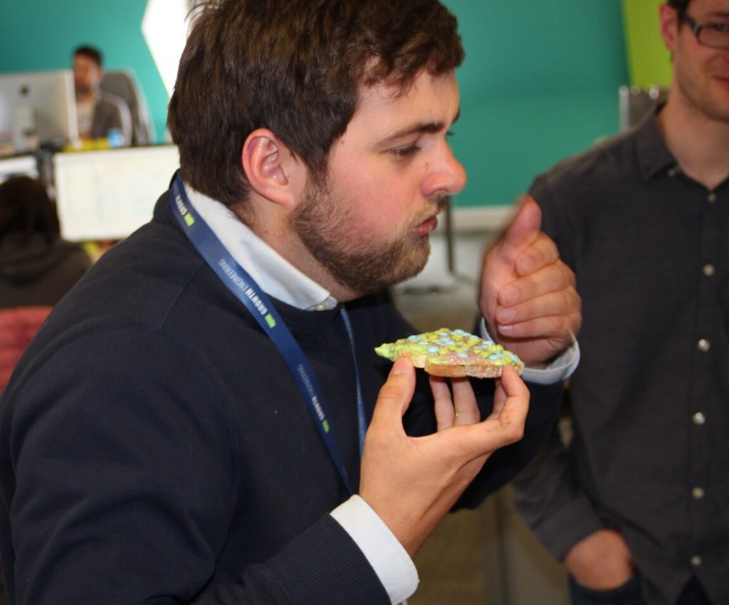 A man eating unicorn toast.